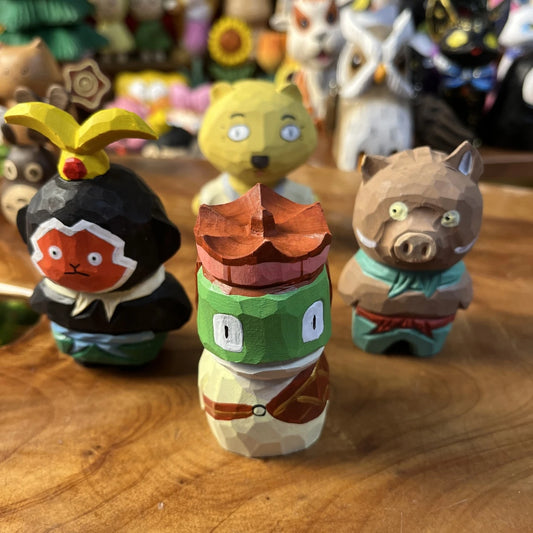 Playful hand-finished wooden mini mountain monster figurine for desk decor