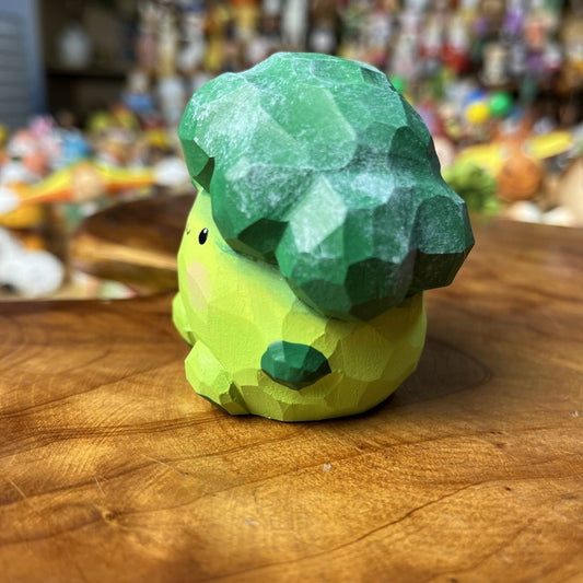 Cute hand-carved broccoli wooden figurine with painted details for desk decor