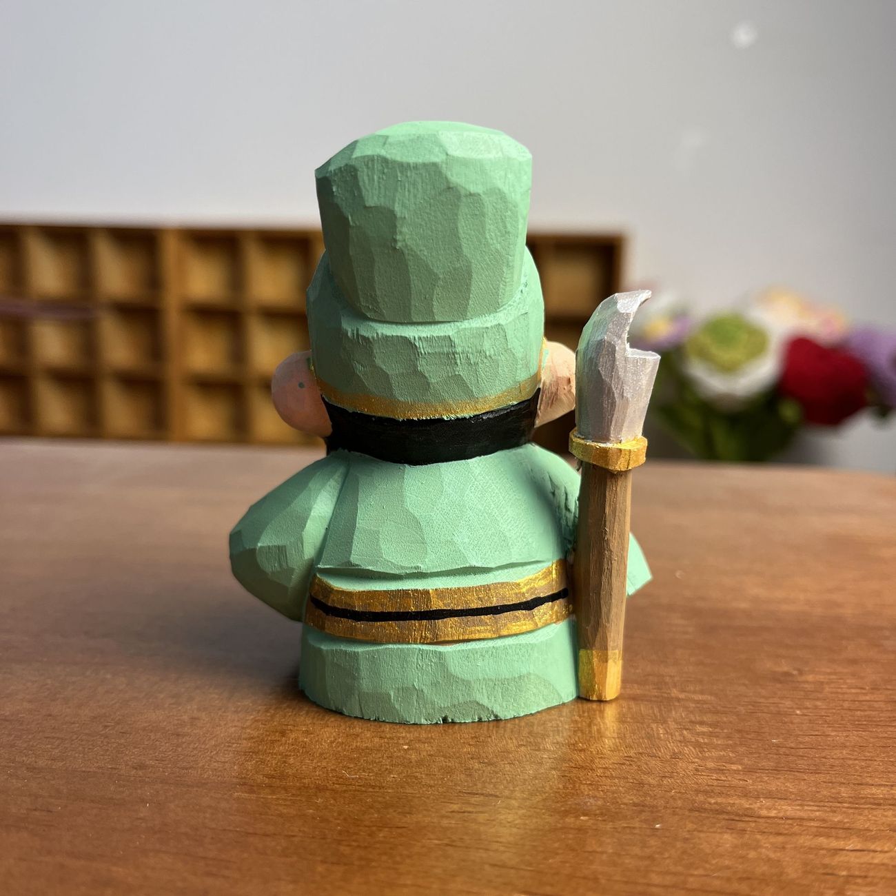 Intricately hand-carved wooden Guan Yu warrior figurine representing strength and wealth