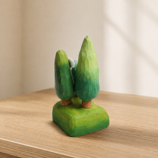 Hand-finished wooden forest tree and cloud scene displayed on a wooden shelf