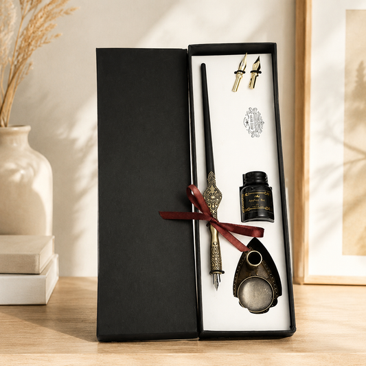 Vintage calligraphy dip pen set displayed with ink bottle and nib accessories.