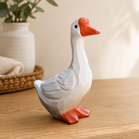 Lucky white goose wooden figurine placed on an office desk.